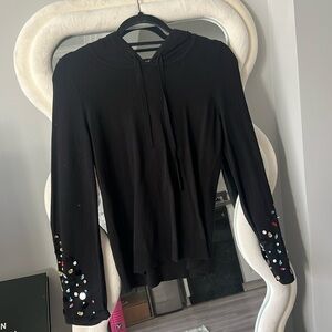 Black knit hoodie with beaded sleeves